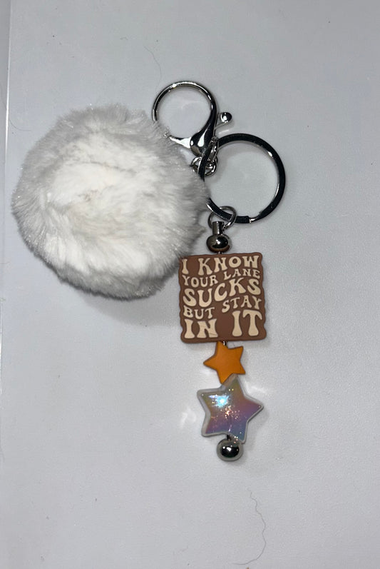 Lane Sucks White Pompom Keychain