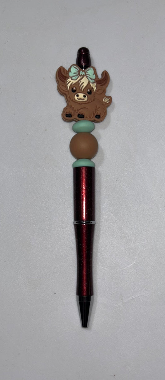 Green Bow Highland Cow Red Pen