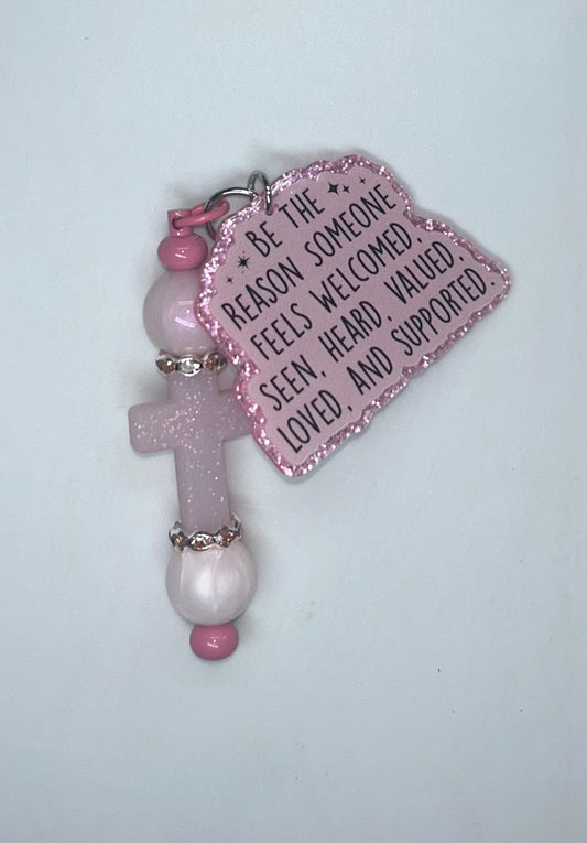 Be The Reason Someone Feels Welcomed. Pink Cross Key Chain