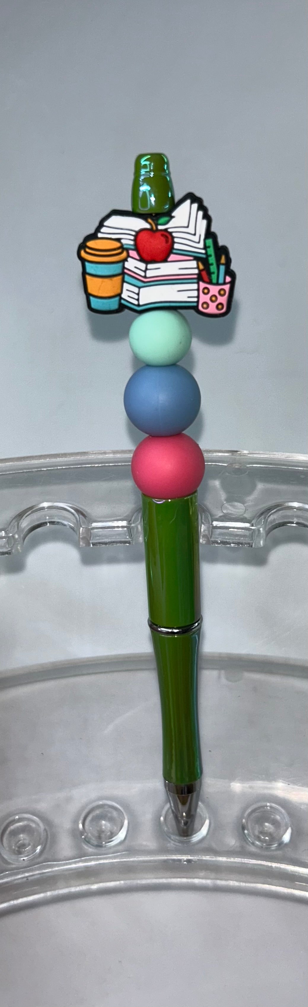 Stack of Books Green Pen
